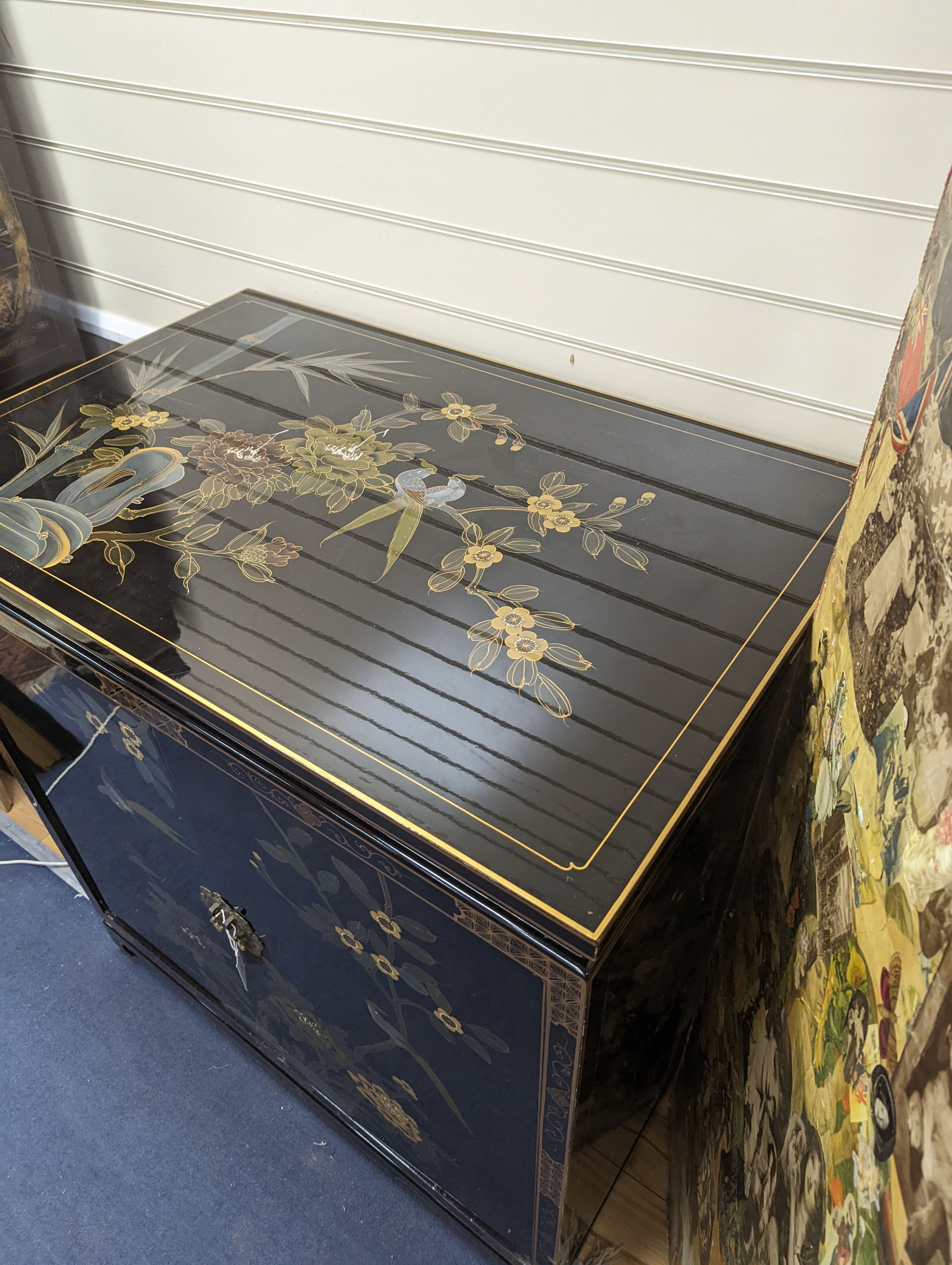 A Chinese lacquer media cabinet. W-94cm, D-61cm, H-102cm.